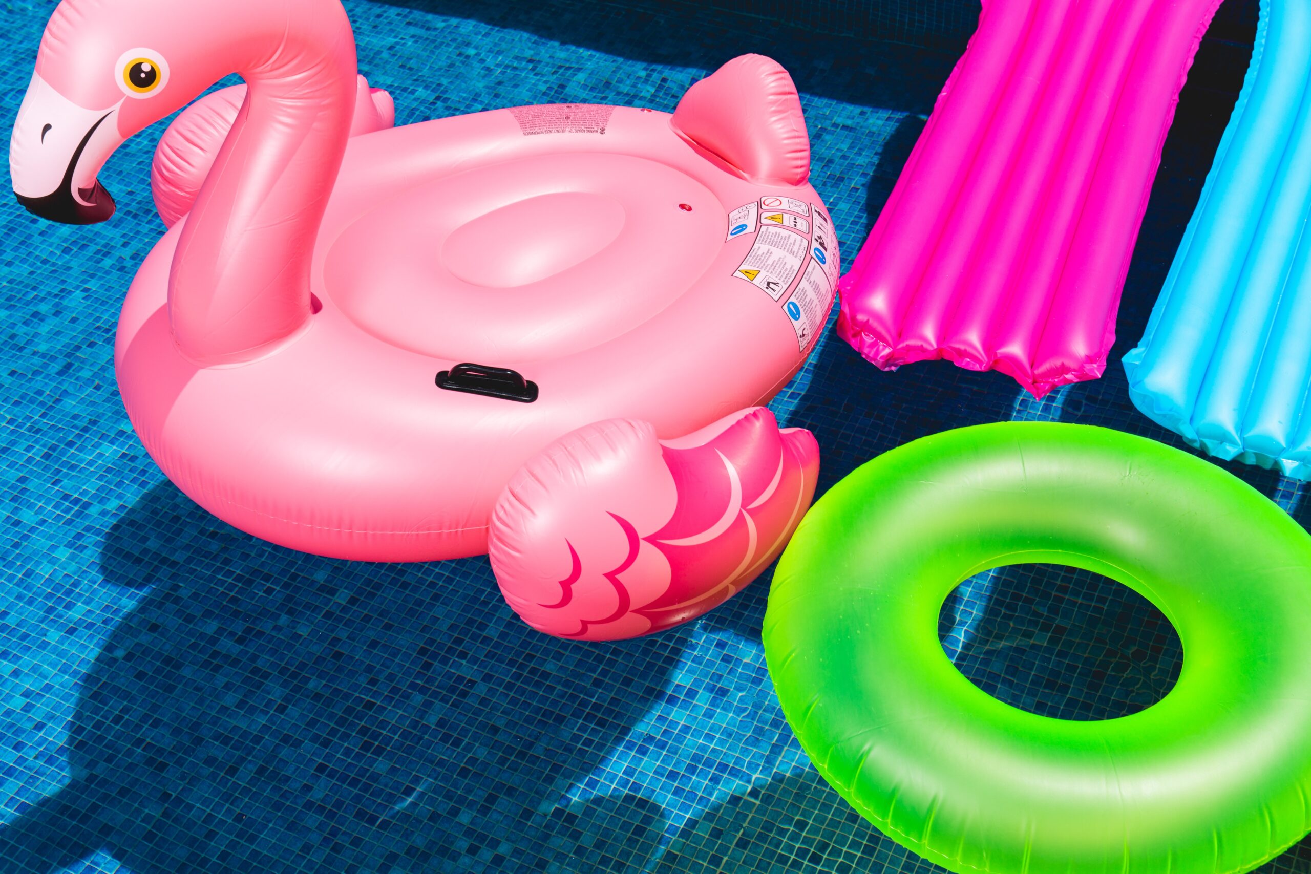 brightly colored floats in a sparkling blue pool