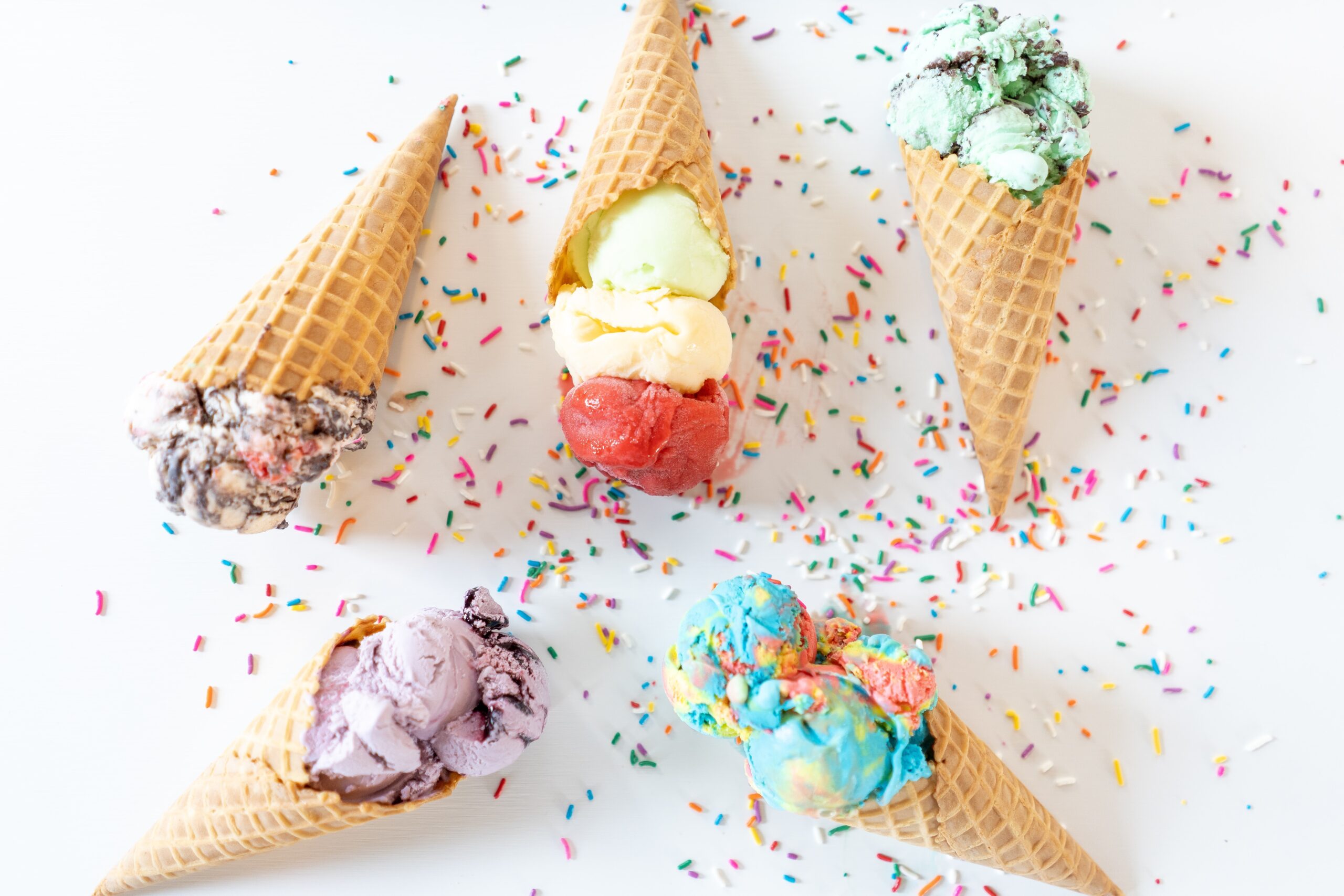 colorful ice creams in waffle cones