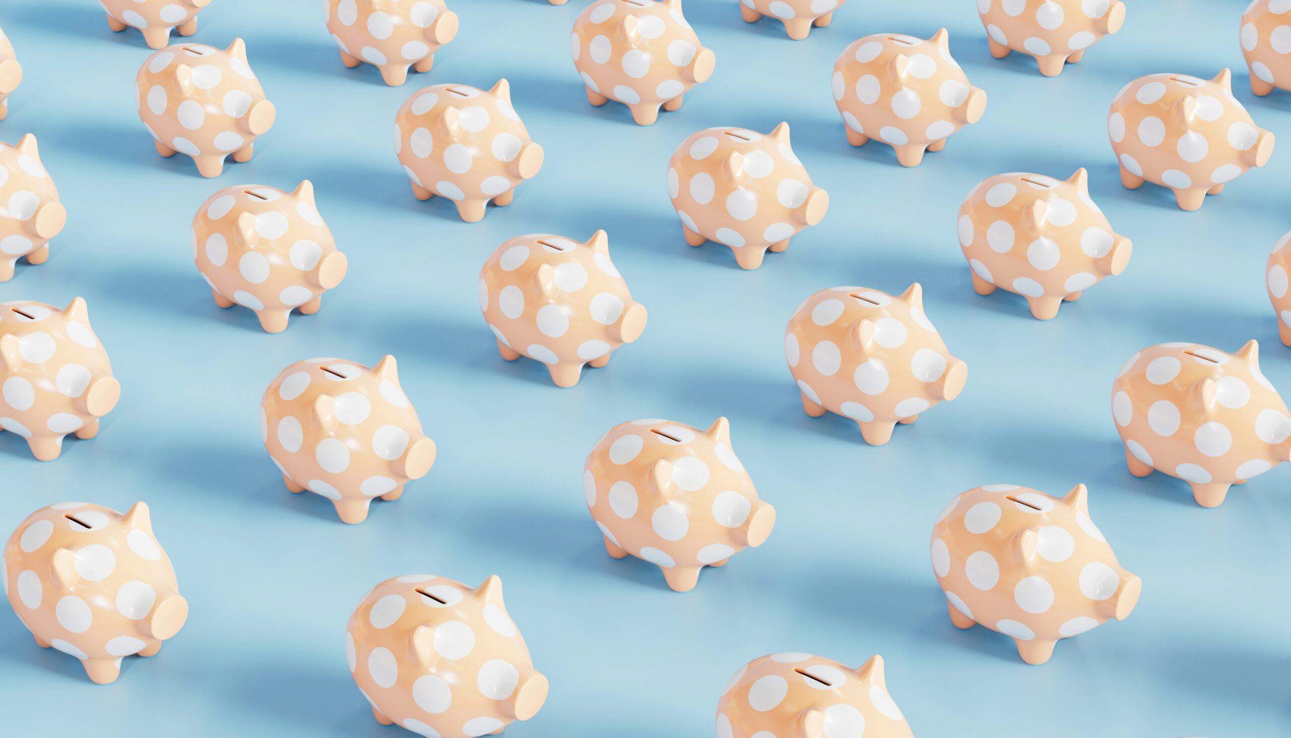 Cute spotted piggy banks on a blue background