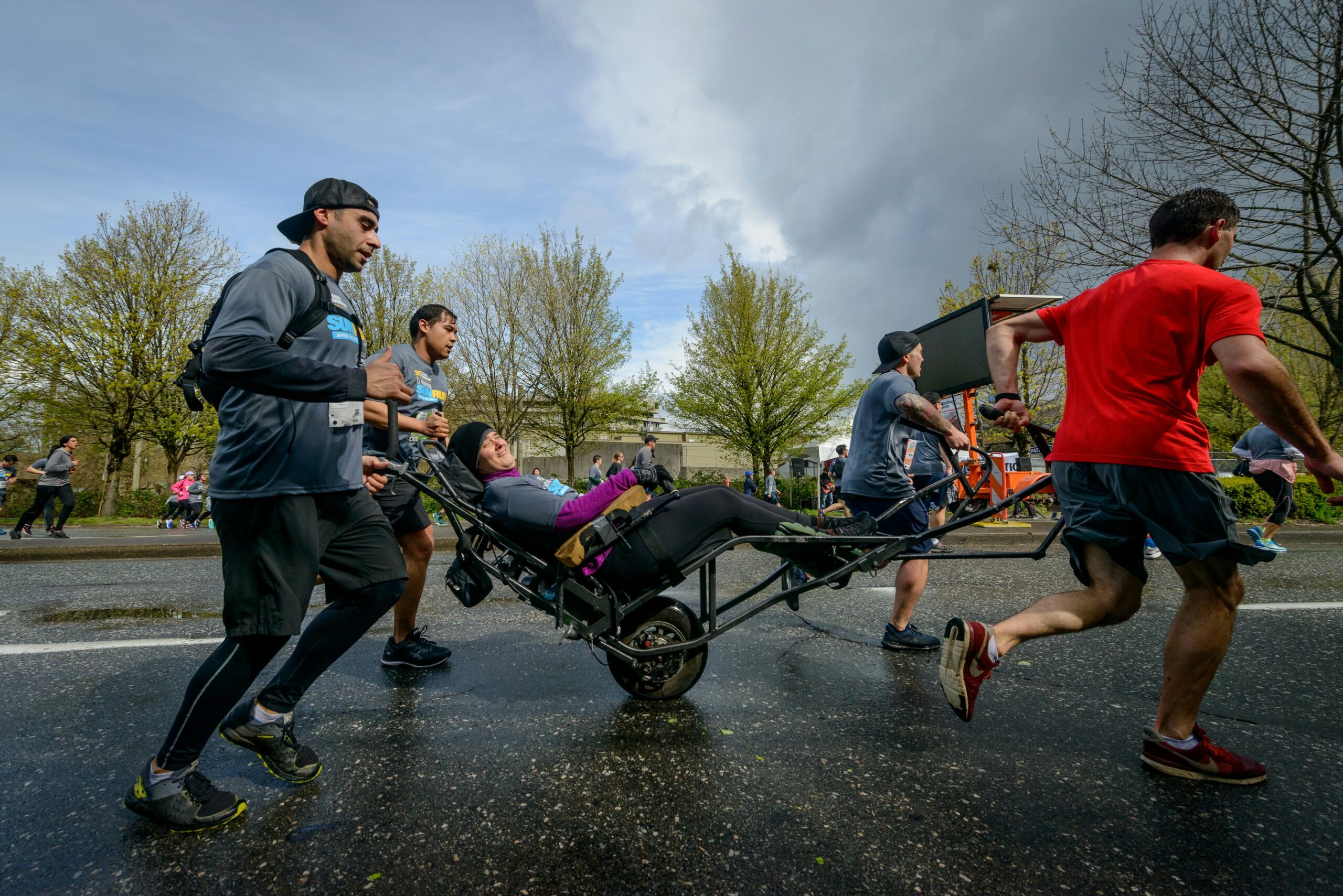 people running and rolling in a walk-a-thon fundraiser