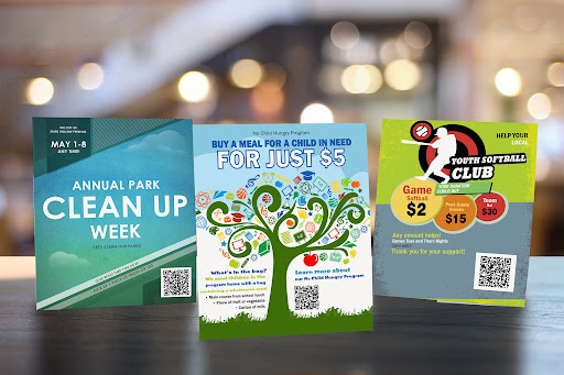 nonprofit-micro-giving-marketing-materials Nonprofit marketing flyers promoting small-dollar giving, QR codes, and local events on a table
